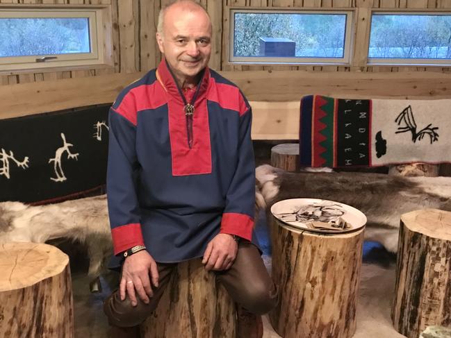 Sami man Ailu Utsi in his traditional turf house, or lavvu. Picture: Penny Hunter