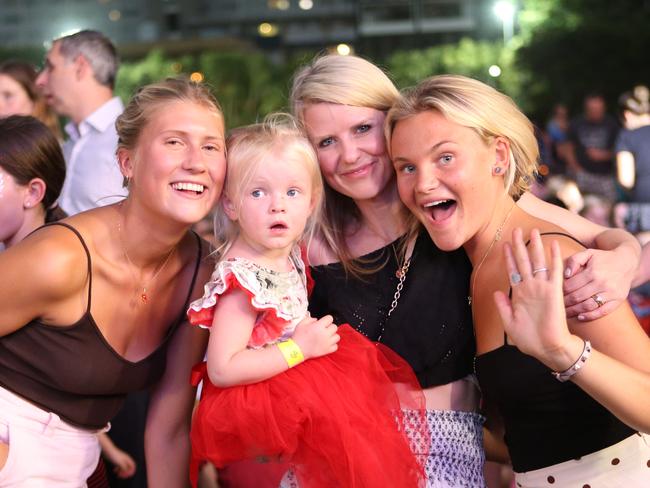 Rebecca Philipp, Tilde Olsson, Siri Fredrikson, Havana Philip, from Sweden watch the Christmas carols at Manly Oval in 2019. Picture: Phillip Rogers