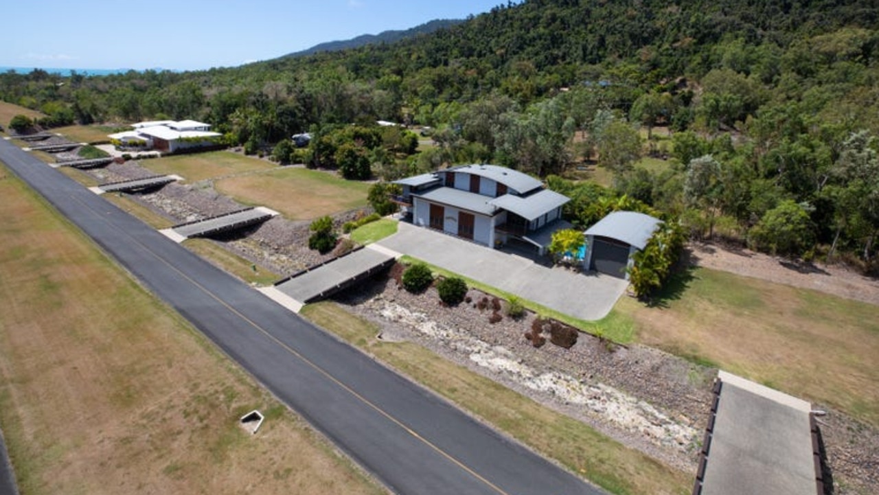 Located in the Whitsunday Aviation Village Estate, this modern residence sits on a 1270 sqm block and is listed for $1.89 million. Like all of the homes in the estate, this one has access to the tarmac and the terminal facilities, and you can literally fly your plane, land and taxi straight into your own private hangar. Owned by Shark Tank star and Queensland entrepreneur Steve Baxter, the property is called Midfield Escape.