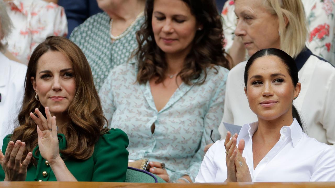 The Duchesses sat diligently, side-by-side, at Wimbledon — despite their alleged feud. Picture: Ben Curtis/AFP.