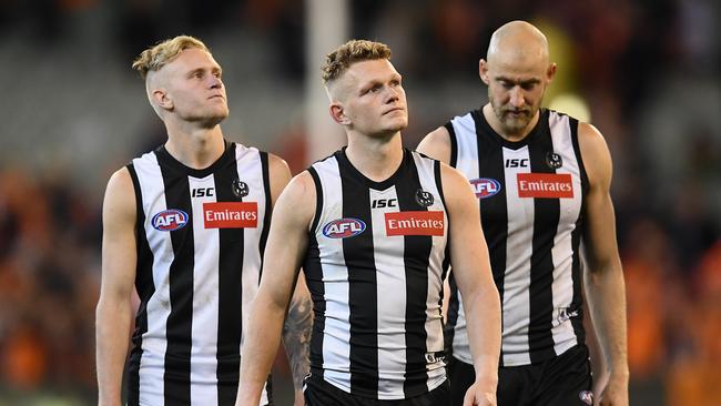 Jaidyn Stephenson, Adam Treloar and Ben Reid. Picture: Quinn Rooney/Getty Images