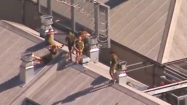 Channel 9 helicopter footage of prisoners on the roof at Borallon Training and Correctional Centre on November 6, 2022. Picture: 9 News Queensland