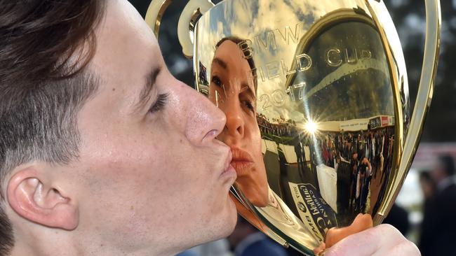 Cory Parish kisses the Caulfield Cup. Picture: Jay Town