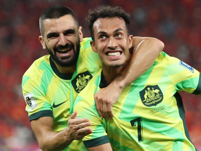 HANGZHOU, CHINA - MARCH 25: Nishan Velupillay of Australia celebrates after scoring the team's second goal during the FIFA World Cup Asian Qualifiers Group C match between China and Australia at Hangzhou Olympic Sports Centre Stadium on March 25, 2025 in Hangzhou, China. (Photo by Lintao Zhang/Getty Images)