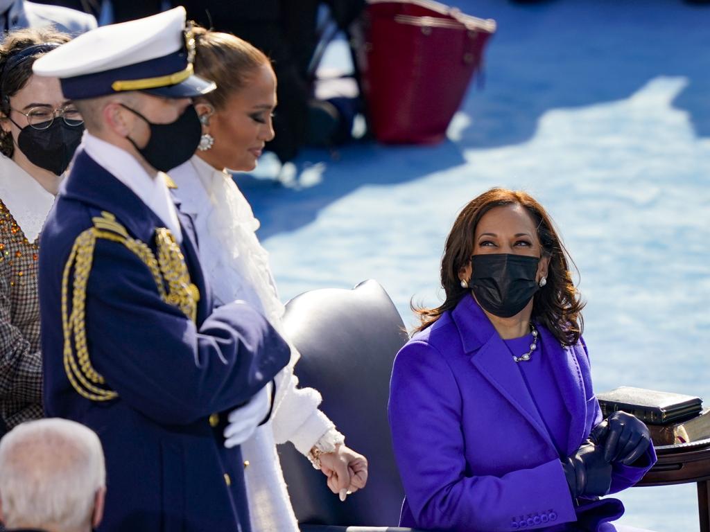 Newly sworn in Vice President Kamala Harris looks back at Jennifer Lopez during the inauguration. Picture: Getty Images