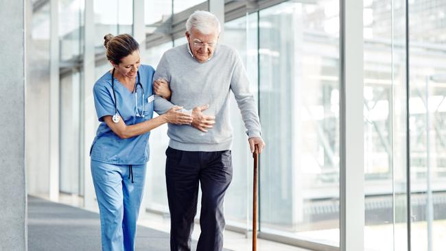 AGED CARE/NURSING HOME/SENIOR/RESIDENTIAL CARE. Picture: istock   Shot of a female nurse assisting her senior patient while walking