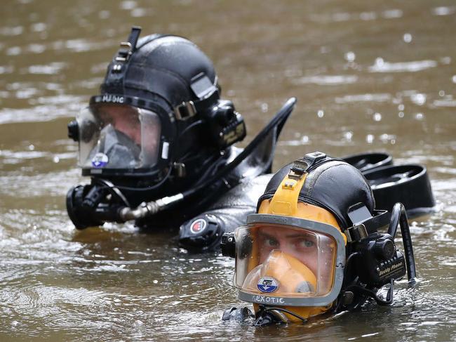 Police divers at the rural property. Picture: David Swift