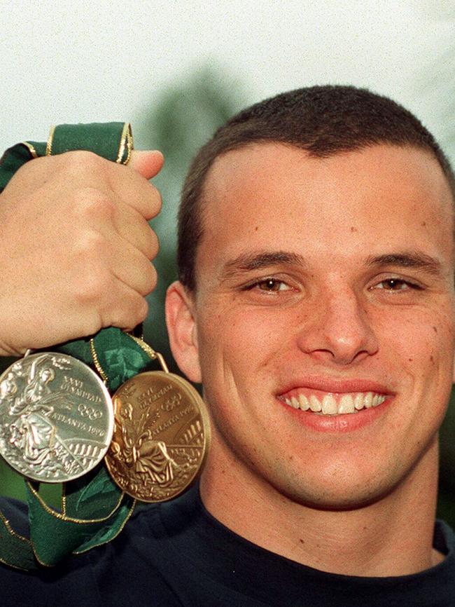 Miller with his silver and bronze medals from the 1996 Atlanta Olympic Games.