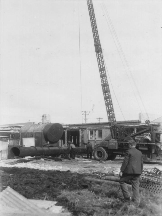 Lifting the stack on to the boiler at the Brookvale Brewing Co in 1950. Picture Marin Alagich, Northern Beaches Library