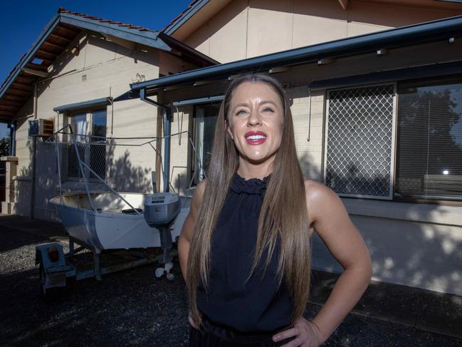 ADELAIDE, AUSTRALIA - Advertiser Photos FEBRUARY 15, 2023: Harcourts Packham Real Estate agent Cassandra Yeates outside the recently listed 19 bed, 4 bath at 51 Kauri Parade in Seacliff, SA. Picture Emma Brasier