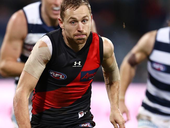 AFL Round 16.  Geelong vs Essendon at GMHBA Stadium.  02/07/2021.   Devon Smith of the Bombers chases the loose footy   .  Pic: Michael Klein