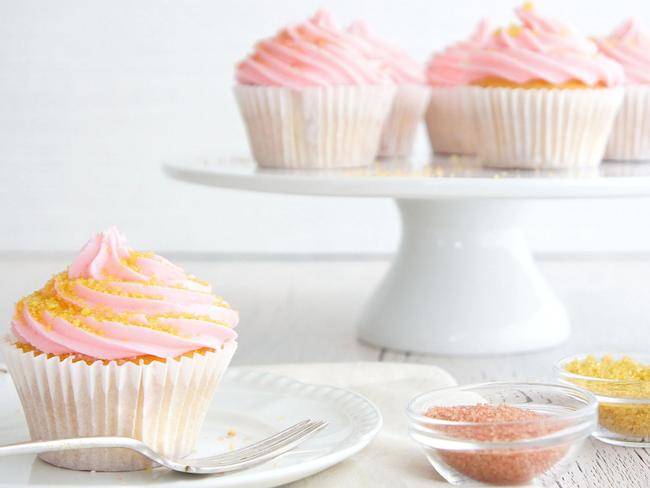 Edible glitter on top of cupcakes.