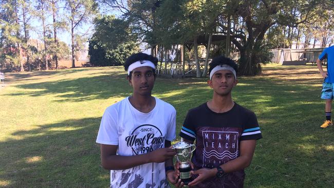 Coopers Plains brothers Harry and Aagash Murali with Ashleigh Barty's replica of the French Open trophy she won. Barty loaned it to her junior club, the West Brisbane Tennis Centre.