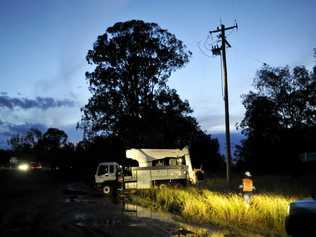 Energex crews attend power lines down across Warrego Hwy near Postmans Ridge. Photo Dave Noonan / The Chronicle. Picture: Dave Noonan