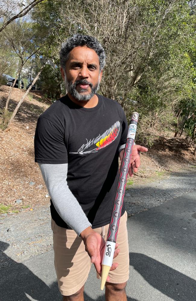 Preston Campbell with Alberton Ormeau's Aboriginal artwork middle stump, designed by himself.