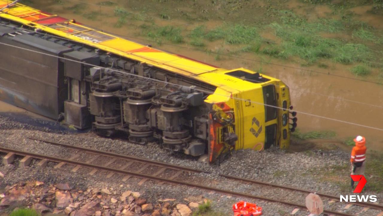 A freight train derailed at Traveston after the tracks were flooded by extreme rain. Pictures: 7 News Sunshine Coast