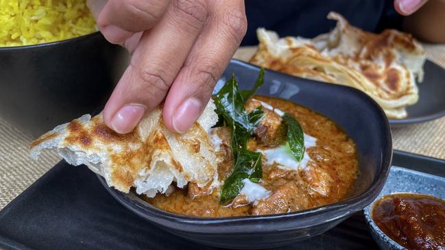 Kafe Kooks’ beef rendang with roti warms you from the inside out. Picture: Jenifer Jagielski