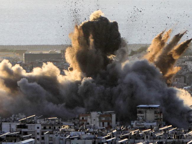 TOPSHOT - A cloud of smoke erupts following an Israeli airstrike on Beirut's southern suburbs on October 19, 2024. Israel expanded operations in Lebanon nearly a year after Hezbollah began exchanging fire in support of its ally, Hamas, following the Palestinian group's deadly attack on Israel on October 7, 2023. (Photo by AFP)