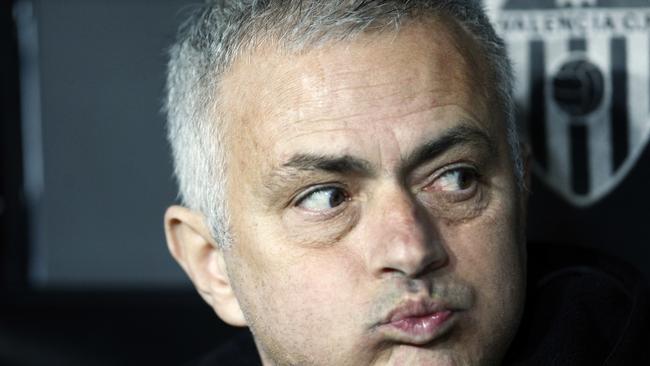 FILE - In this Wednesday, Dec. 12, 2018 file photo Manchester United coach Jose Mourinho looks out from the bench prior a Group H Champions League soccer match between Valencia and Manchester United at the Mestalla Stadium in Valencia, Spain. Manchester United says Jose Mourinho has left the Premier League club with immediate effect. The decision was announced Tuesday Dec.18, 2018, two days after a 3-1 loss to Liverpool left United 19 points off the top of the Premier League after 17 games. (AP Photo/Alberto Saiz)