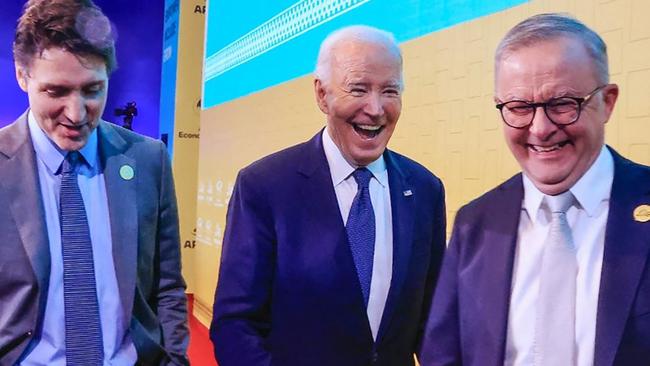 Joe Biden flanked by Canadian leader Justin Trudeau and Australian PM Anthony Albanese smiling during the APEC Summit in Lima on November 15, 2024. Picture: Handout/Andina/AFP