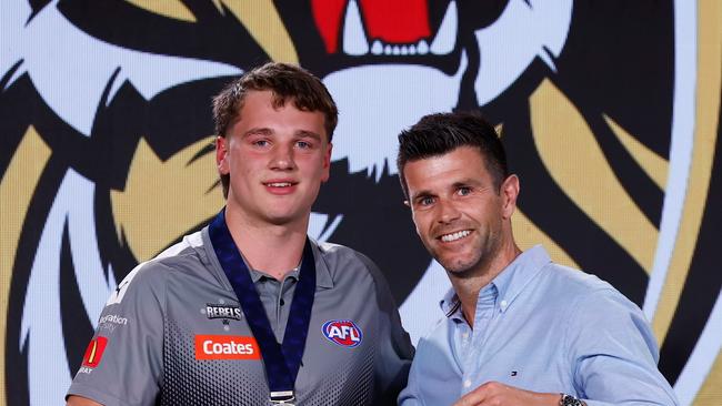 The number one pick, Sam Lalor is presented his jumper by Trent Cotchin during the 2024 Telstra AFL Draft. Lalor is from Bacchus Marsh. Picture: Michael Willson/AFL Photos via Getty Images