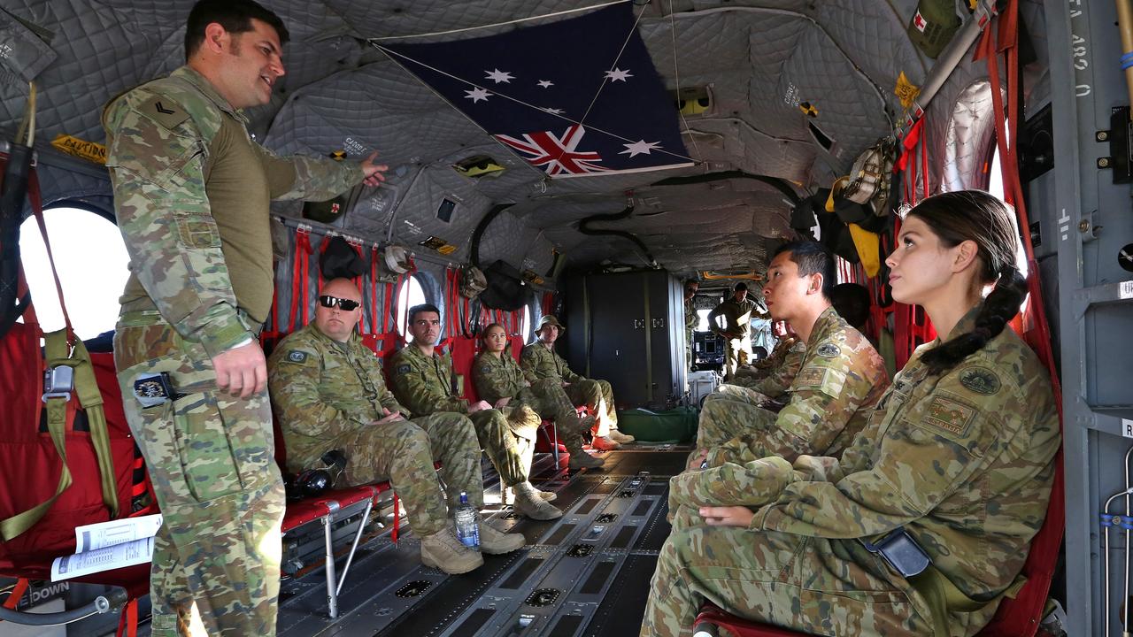 Australian Army soldier Corporal Ross Mead, an aircrewman from the 5th Aviation Regiment, delivers a safety brief to personnel of 9th Force Support Battalion before their flight on CH-47F Chinook during exercises last month. Picture: Defence