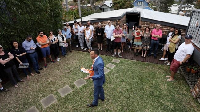 An auction in Sydney, Australia’s least affordable city.