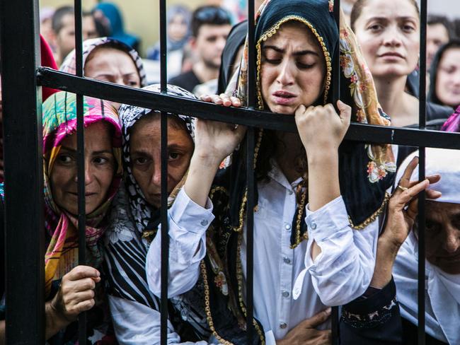 Women react during the funeral of a victim of the failed July 15 coup attempt in Istanbul on July 17, 2016. Turkish President Recep Tayyip Erdogan vowed Sunday to purge the “virus” within state bodies, during a speech at the funeral of victims killed during the coup bid he blames on his enemy Fethullah Gulen. Picture: AFP PHOTO / GURCAN OZTURK