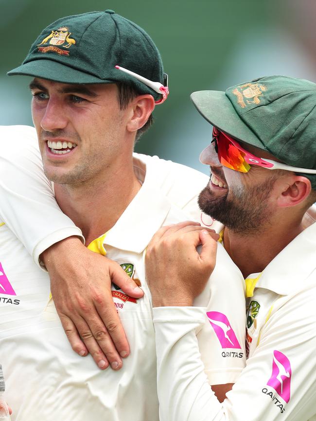 Great mates: Pat Cummins and Nathan Lyon share a hug. Picture: Brett Costello