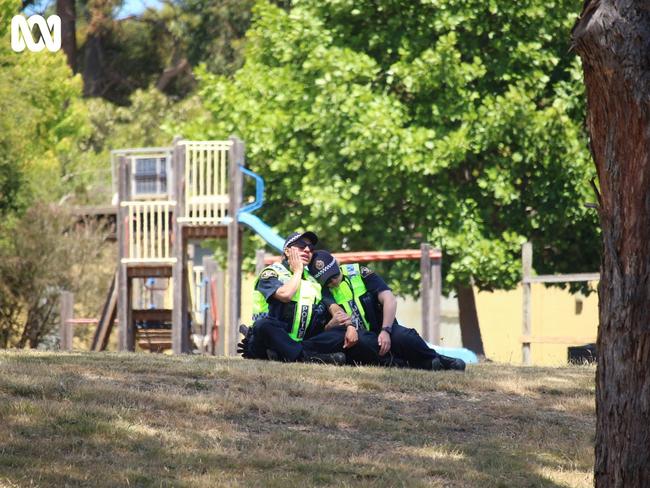 Devastated police officers at the scene of a jumping castle accident, where six children died, Hillcrest Primary School in Devonport. Photo: Monte Bovill for ABC News