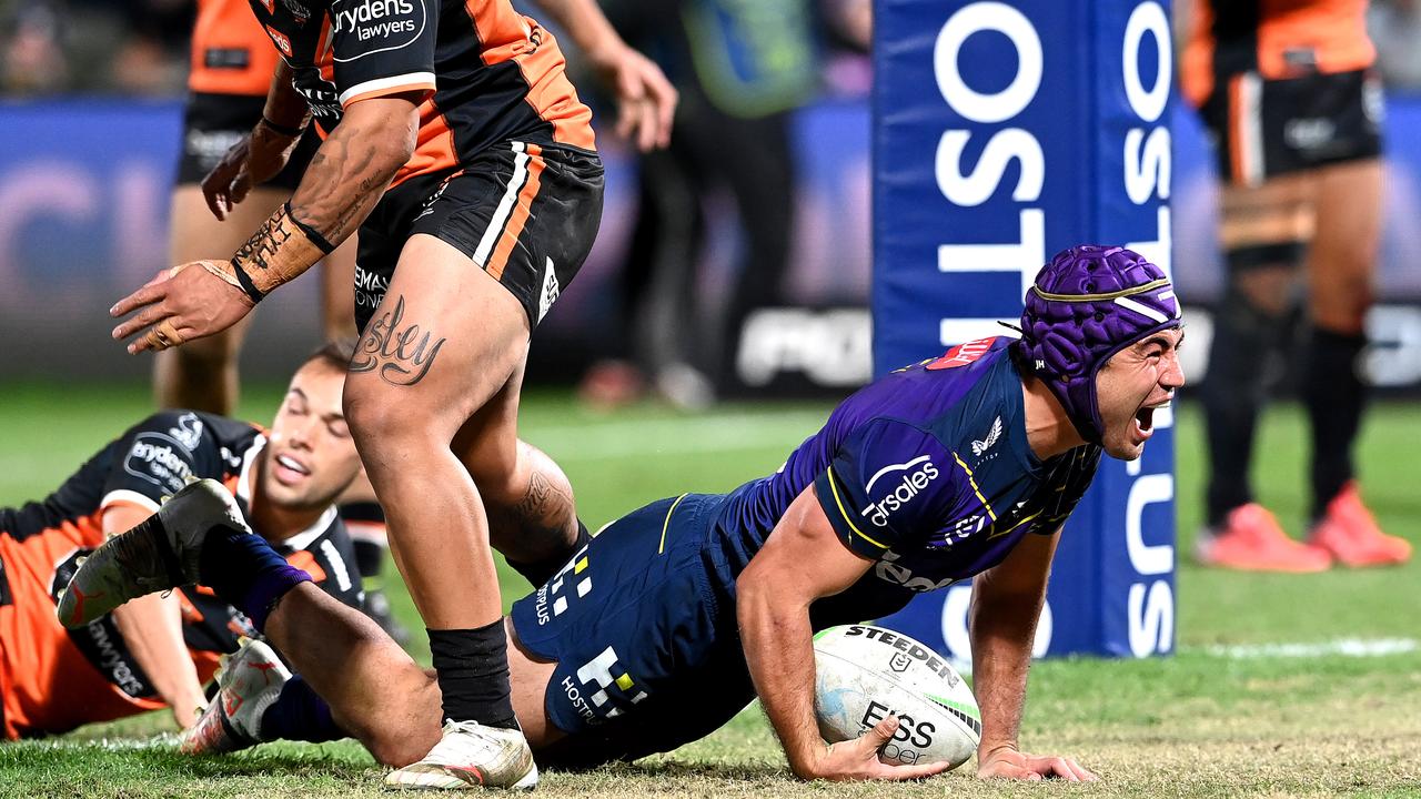 Jahrome Hughes of the Storm celebrates scoring a try. Picture: Bradley Kanaris/Getty Images