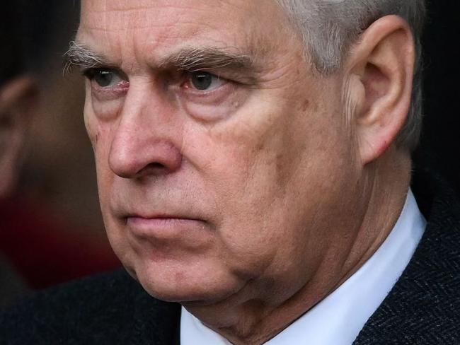 Britain's Prince Andrew, Duke of York reacts as he leaves at the end of the Royal Family's traditional Christmas Day service at St Mary Magdalene Church in Sandringham, Norfolk, eastern England, on December 25, 2022. (Photo by Daniel LEAL / AFP)