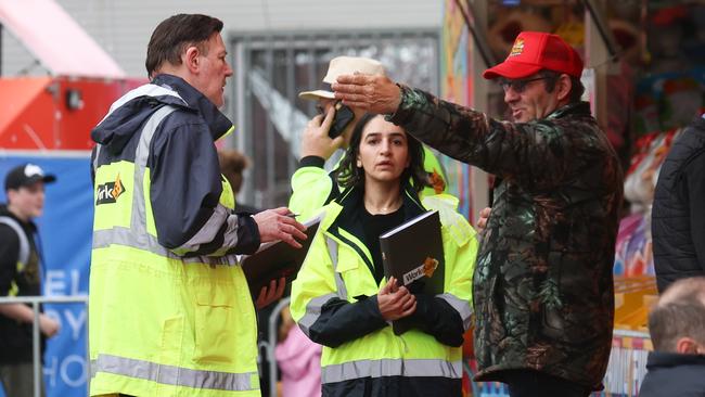 WorkSafe officers speak to a man at the scene of the incident. Picture: Brendan Beckett