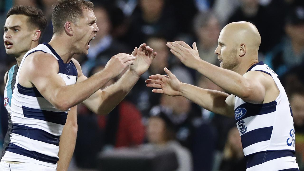 Port Adelaide and Geelong AFL teams facing off