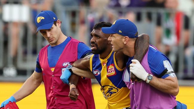 PERTH, AUSTRALIA - APRIL 02: Liam Ryan of the Eagles is assisted off the field during the 2023 AFL Round 03 match between the Fremantle Dockers and the West Coast Eagles at Optus Stadium on April 2, 2023 in Perth, Australia. (Photo by Will Russell/AFL Photos via Getty Images)