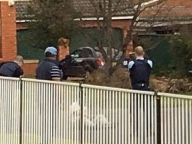 NSW surround Ihsas Khan with tasers drawn after Khan allegedly set upon Minto resident Wayne Greenhalgh with a large hunting knife. Picture supplied