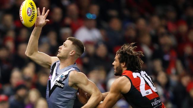 Peter Ladhams of the Power contests a throw-in with Zac Clarke of the Bombers. Picture: Michael Willson/Getty Images