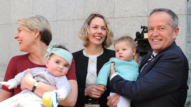 Deputy Leader of the Opposition Tanya Plibersek (left) and Labor leader Bill Shorten appeared to be getting in a little early practice pitching to babies when announcing Labor’s plan on superannuation for women and parents yesterday. Picture: Kym Smith