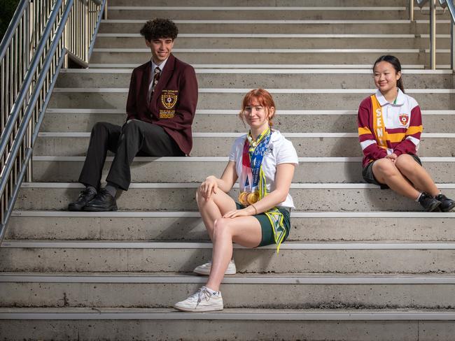 23-08-2021 Swimmer Mollie O'Callaghan back to school at St Peters Lutheran returning from the Olympics with 2 Gold and a Bronze medal. With school mates Daniel Storey and Minh-ai Pham. PICTURE: Brad Fleet