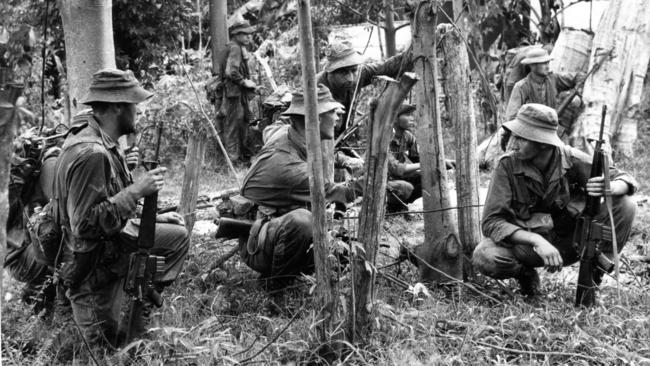 Australian Army infantry prepare to sweep through the Viet Cong-controlled village of Chinh Duc in Binh Tuy Province, 1965