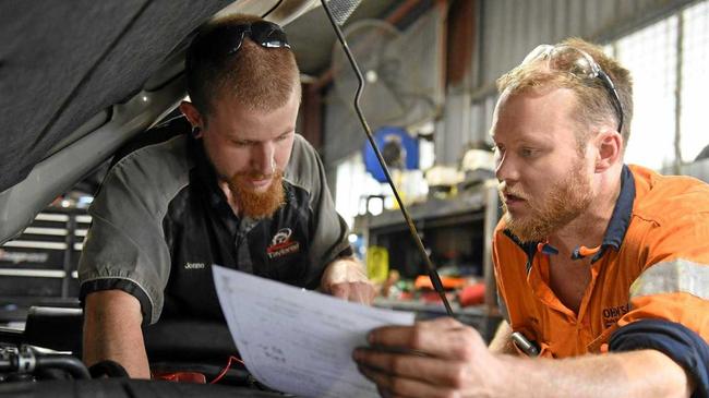 Jonathan Read and Mark Johnston working at Taylored Automotive. Picture: Contributed