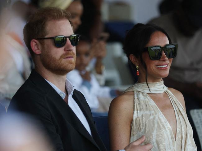 Britain's Prince Harry (L), Duke of Sussex, and Britain's Meghan (R), Duchess of Sussex, attend a charity polo game at the Ikoyi Polo Club in Lagos on May 12, 2024 as they visit Nigeria as part of celebrations of Invictus Games anniversary. (Photo by Kola Sulaimon / AFP)