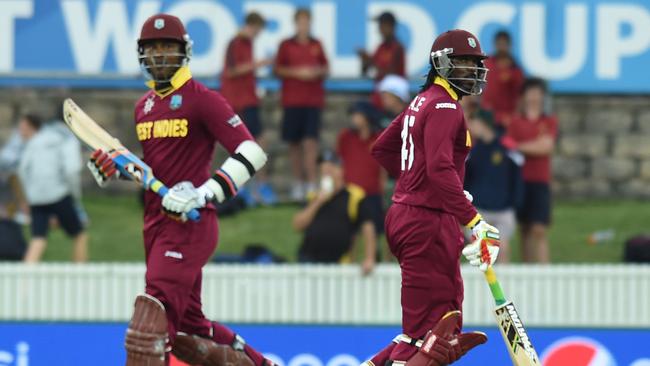 West Indies batsmen Chris Gayle (right) and Marlon Samuels run between wickets as West Indies plays Zimbabwe in the ICC Cricket World Cup match in Canberra in 2015. Picture: AAP