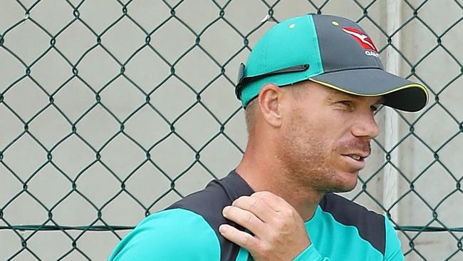 David Warner hold his neck during the Australian nets session at The Gabba on November 21, 2017 in Brisbane, Australia. (Photo by Chris Hyde/Getty Images)
