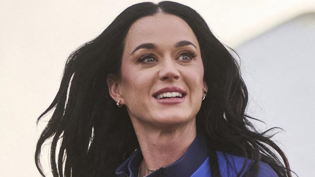 This handout photo from Blue Origin shows US singer Katy Perry upon return to Earth after a flight on Blue Origin New Shepard NS-31, which brought the passengers beyond the Karman line -- the internationally recognized boundary of space, in Van Horn, West Texas, April 14, 2025. Pop star Katy Perry completed a brief foray into space Monday, roaring to the edge of the cosmos with an all-women crew on one of billionaire Jeff Bezos's rockets. The 