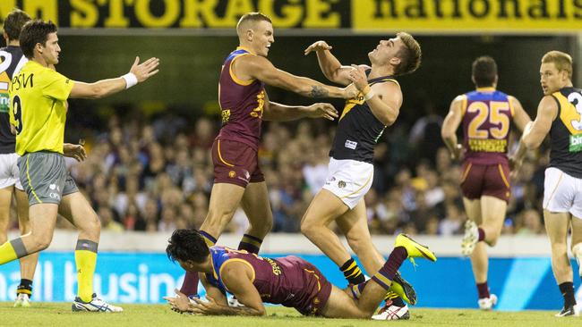 Robinson will reunite with former Brisbane Lions teammate and current Lauderdale playing-coach Allen Christensen (pictured lying on the ground) in 2024. (AAP Image/Glenn Hunt)