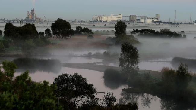 Fog over the wetlands looking towards Port Adelaide and Adelaide Brighton Cement. Picture: Dean Martin