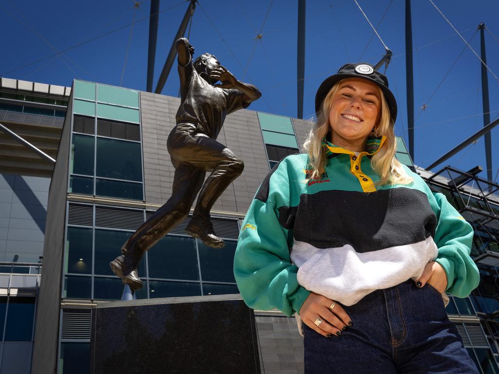 Warnie’s daughter Brooke Warne, one of his three kids, was pictured with the statue of her father in December 2024. Picture: Mark Stewart