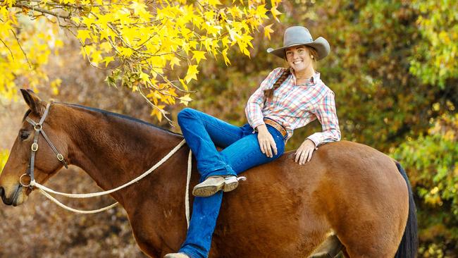 Tup Forge holds the title of 2025 Australian Women's Ranch Bronc Champion. Tup works as a farm hand on Forges farm and is pictured here with with her dads horse named Fox. Pictures: Zoe Phillips