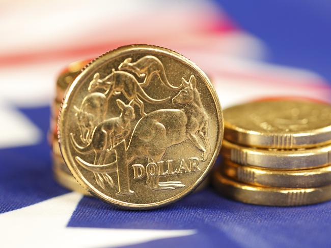 Australian coins sitting on an Australian flag. money coins dollars generic